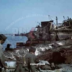 Tripoli harbour in Libya, 1942. Destroyed Burning german transport ships after Allied air attack.