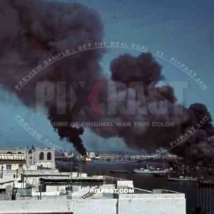 Tripoli harbour in Libya, 1942. Destroyed Burning german transport ships after Allied air attack.