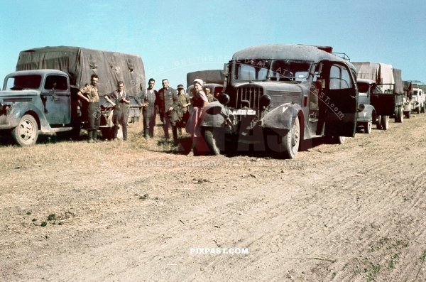 Troop transport column with opel trucks and pre war bus in retreat with Romania army April 1944 Krime Krim