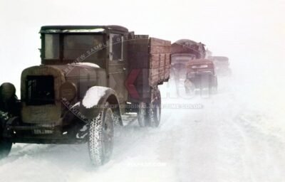 Two german soldiers driving a captured Russian GAZ army truck in KRIM Crimea winter 1943. Snow Storm.