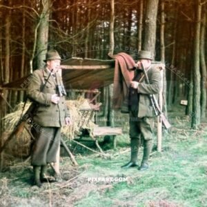 Two heavy German hunters with their hunting rifle with sniper scope in forest. Saxony Germany 1939