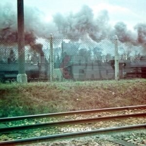 Two large German Reichbahn Steam Locomotive Trains driving cargo in the West train station in Vienna Austria February 1944