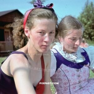 Two young German women in colorful Dirndl dress and summer dress. Lake Park in Leipzig Germany. Summer 1940