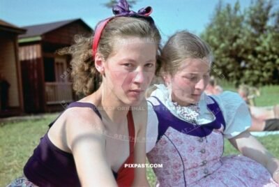 Two young German women in colorful Dirndl dress and summer dress. Lake Park in Leipzig Germany. Summer 1940