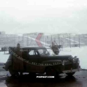 US officers with Sedan Ford Light 1941 Model Staff Car, Soldiers Field, US Army captured Nuremberg Rally field 1945.