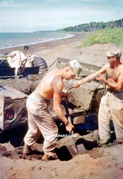 US soldiers digging sand into a Dodge M37 4×4 Pickup Truck. Philippines 1945. Thirteenth Expeditionary Air Force 13 EAF