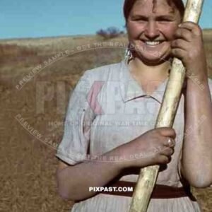 Ukrainian farmer girl in field talks and laughs with German panzer driver, Ukraine, 1941, 22nd Panzer Division.