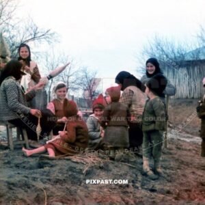 Ukrainian farming children playing in the mud. Spinning cloth. Eastern Ukraine 1942