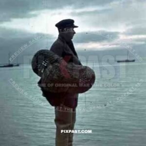 Ukrainian fisher man with nets on the beach of Sudak Bay, Crimea, Ukraine 1942, 22nd Panzer Division.