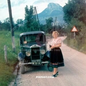 Vienna wife standing beside her classic car Peugeot 201 1930 Austria 1938