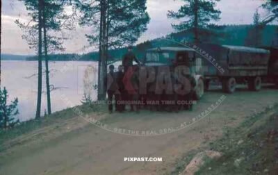 WW2 color 1945 Finland german wehrmacht supply trucks lake