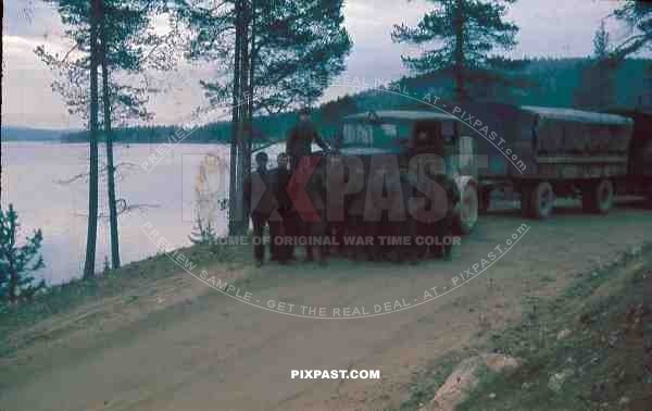 WW2 color 1945 Finland german wehrmacht supply trucks lake