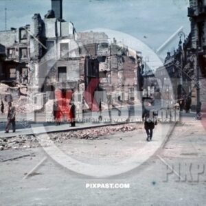 WW2 color Luftwaffe officer Bindewald in destroyed bombed city town Krakow Poland 1940