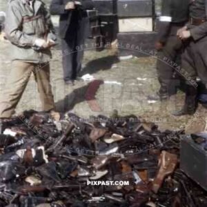 Waffen SS Officers surrender pistols to American officer of the 101st Cavalry Regiment. Schwendt Austria 1945