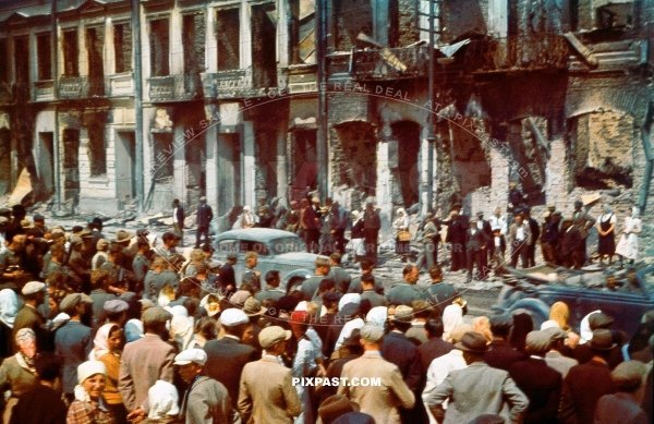 Wehrmacht army vehicle convoy drive through bombed destroyed Smolensk Russia 1941, Parade, Civilians.