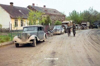 Wehrmacht column with trucks and cars parked in Polish town. Poland 1939. 297 Infantry Division