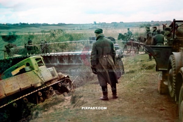 Wehrmacht crossing pontoon bridge. Smolensk 1941. Horch 901 jeep and Russian Komintern 1933 Heavy Artillery Tractor