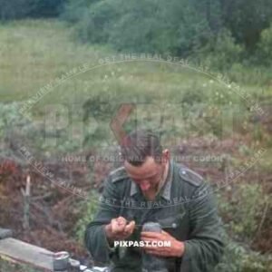 Wehrmacht soldier darning socks at the base between Bryansk (Russia) and Konotop (Ukraine) 1944, handgrenade