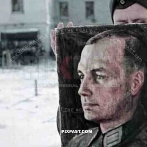 Wehrmacht soldier holding up a portrait painting of a military Doctor at the monastery in Syrkovo, Russia 1941