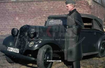 Wehrmacht soldier in Niederaußem (Von-Galen-Weg), Germany 1940. Adler 2 Liter Cabriolet EV 1938. 4th Panzer Division.