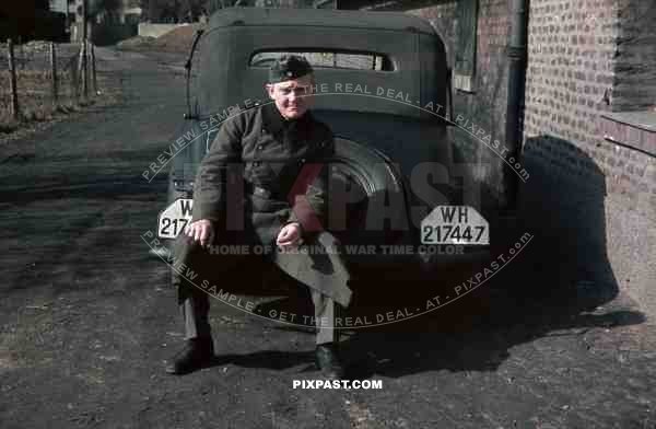 Wehrmacht soldier in Niederaußem (Von-Galen-Weg), Germany 1940. Adler 2 Liter Cabriolet EV 1938. 4th Panzer Division.