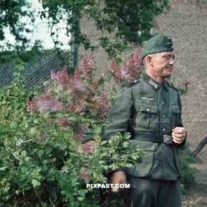 Wehrmacht soldier in garden in Niederaußem, Germany 1940