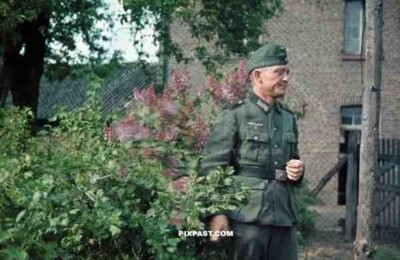 Wehrmacht soldier in garden in Niederaußem, Germany 1940