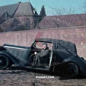Wehrmacht soldier with car in Niederaußem, Germany 1940