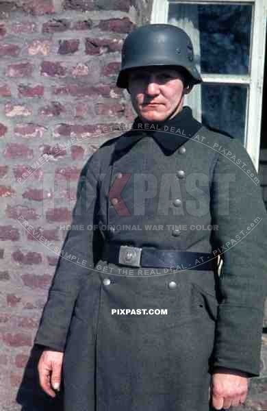 Wehrmacht soldier with helmet in Niederaußem, Germany 1940