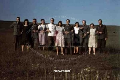 Wehrmacht soldiers posing with local girls in Lidzbark Warmiski (near Heilsberg), Poland ~1942.  207. Infantry Division.