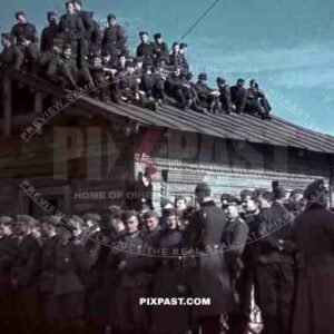 Wehrmacht soldiers sitting on the roof of a cabin in Krementschuk, Ukraine 1941