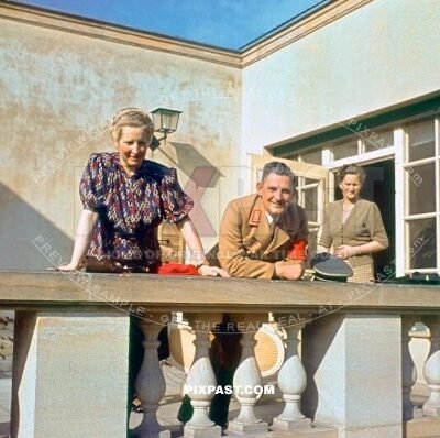Wife on balcony in Munich Bavaria Germany with a visit from a SA brown shirt local political officer 1939