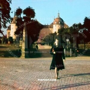 Young German lady standing with red hand bag in front of Schloss Moritzburg Saxony Germany 1942