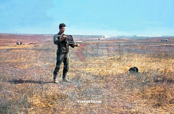 Young German soldier wheeling out new radio cables along Russian fields. Stalingrad 1942.  297 Infantry Division