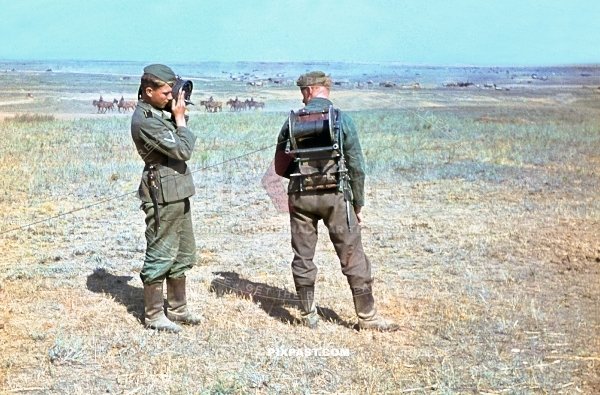 Young German soldier wheeling out new radio cables along Russian fields. Stalingrad 1942.  297 Infantry Division