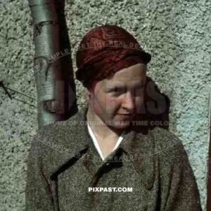 Young German woman 1936 in American style 20s silk cap and jacket.