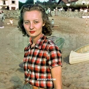Young attractive french women with fashionable shirt and belt buckle in Normandy Beach France June 1940