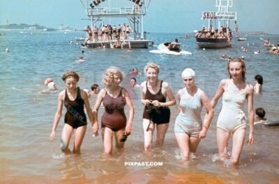 Young french women in swim suites playing the sea and beach in Saint Nazaire westcoast France September 1940