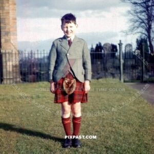 Young man Ian Miller standing with his friends in traditional Scottish kilt near Edinburgh Scotland. War time 1944