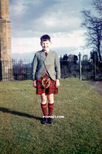 Young man Ian Miller standing with his friends in traditional Scottish kilt near Edinburgh Scotland. War time 1944