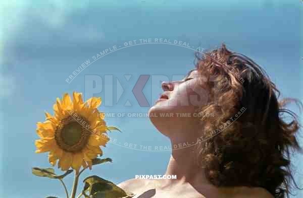 beautiful hungarian woman naked in flower field, Hungary 1942