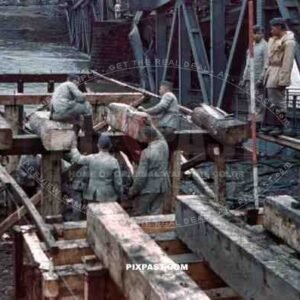 construction of a wooden bridge next to a broken rail bridge near Belgrade, Serbia ~1941