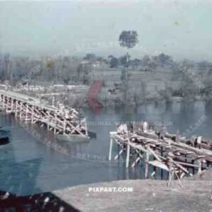 construction of a wooden bridge next to a broken rail bridge near Belgrade, Serbia ~1941