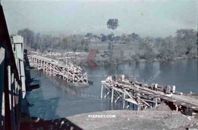 construction of a wooden bridge next to a broken rail bridge near Belgrade, Serbia ~1941