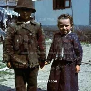 farm children stand to attention for german soldier, Yugoslavia, 1941