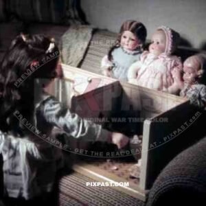 little girl playing with her dolls and dollhouse, Germany 1938