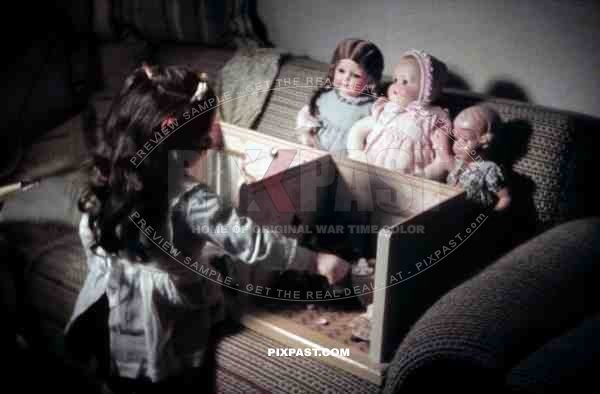 little girl playing with her dolls and dollhouse, Germany 1938