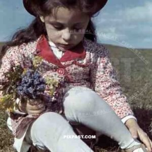 little girl sitting on a field, Germany 1939