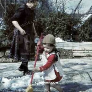 little girl sweeping the snow, Germany 1939