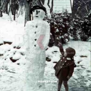 little girl with a snowman, Germany 1939